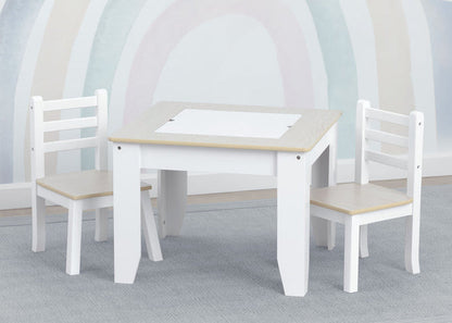 White children's table and chairs with a light wood finish on a gray floor.