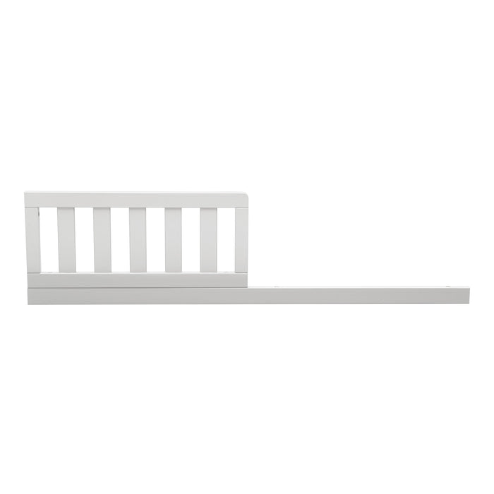White wooden crib with slatted headboard on a white background