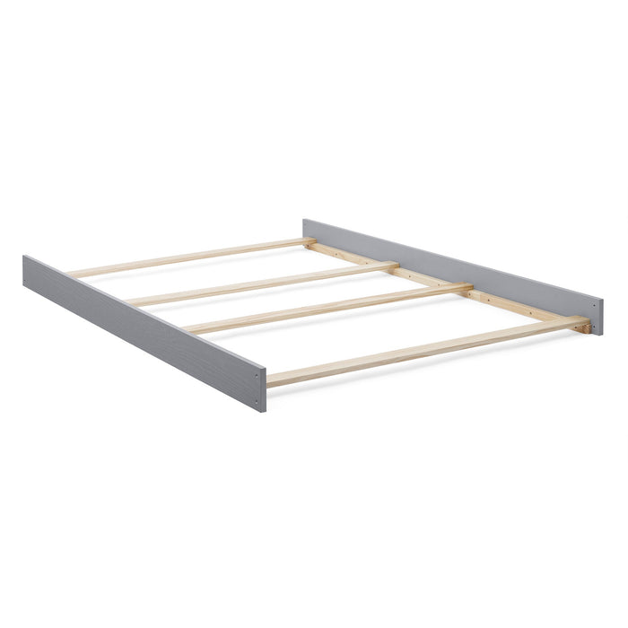 Wooden bed frame with gray headboard on a white background