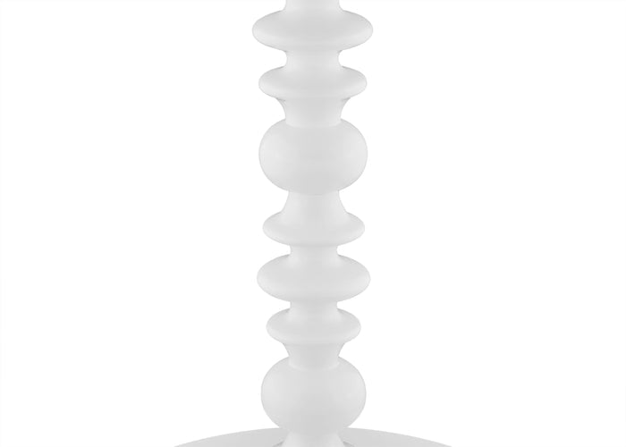 White decorative object with a spiral design on a white background