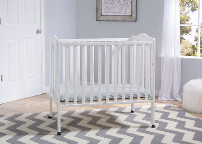 Delta Children Bianca (130) Portable Folding Crib with Mattress, room shot a1a
