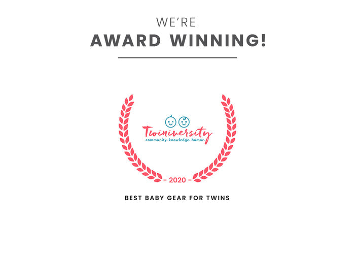 Little Folks by Delta Children Aqua Geo (2040) Twin EZ Fold Ultra Compact Double Bassinet Badge